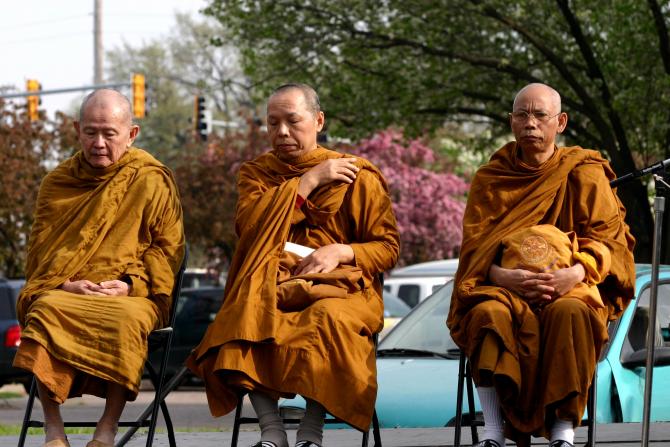 Thai monks help to bless the ground