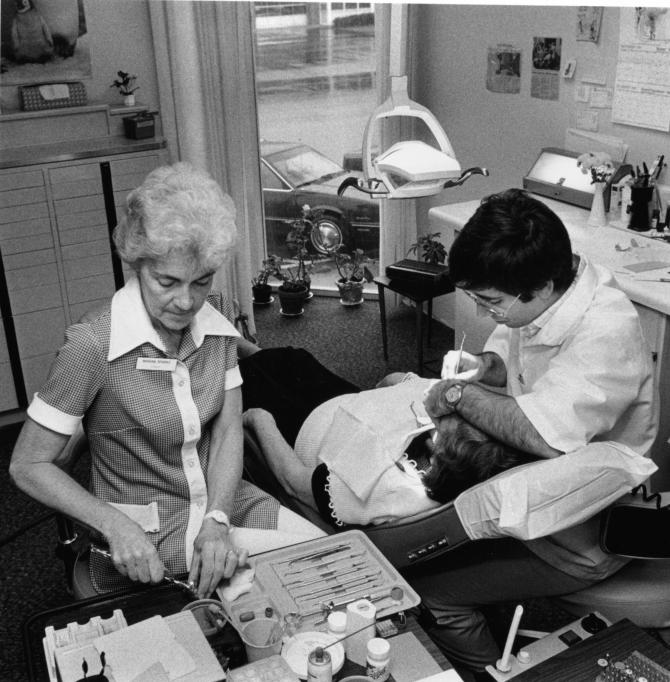 A patient receives a dental exam