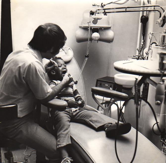 A young boy receives a dental exam