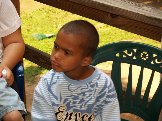 A little boy listens to the discussion