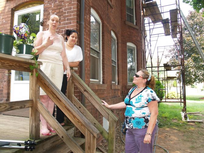 Women chat on the back porch