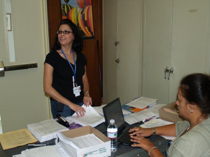 Staff members organize fliers