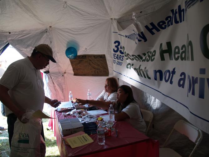 Two women staff the CHC, Inc. Health Fair Booth