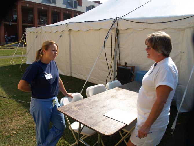 Two staff members at the health fair