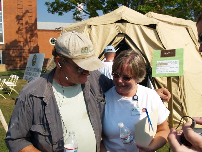 Staff outside of a medical tent