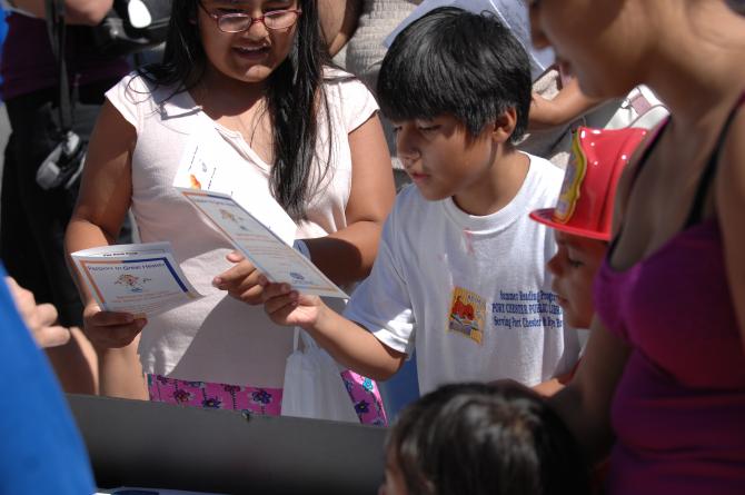 Children inspect the provided health information
