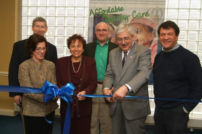 Lindsay Farrell and staff ready to cut the ribbon