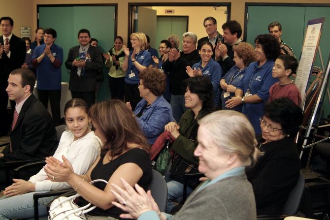 The audience reacting to the event speaker