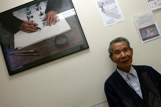 A patient in front of art work