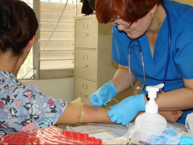 A staff member takes blood