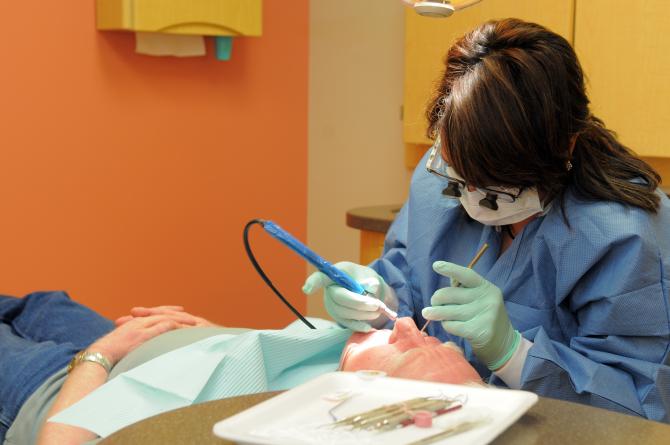 Dr. Rodriguez performing a dental exam