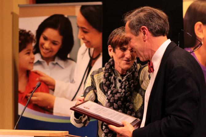 Rep. Rosa DeLauro presents Mark with a plaque