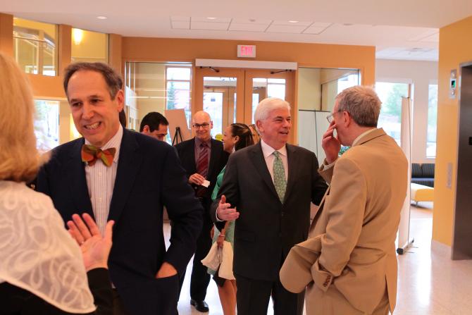 Mark and Senator Dodd talk with guests