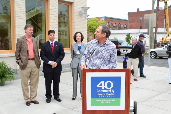 Mark talks outside the new building