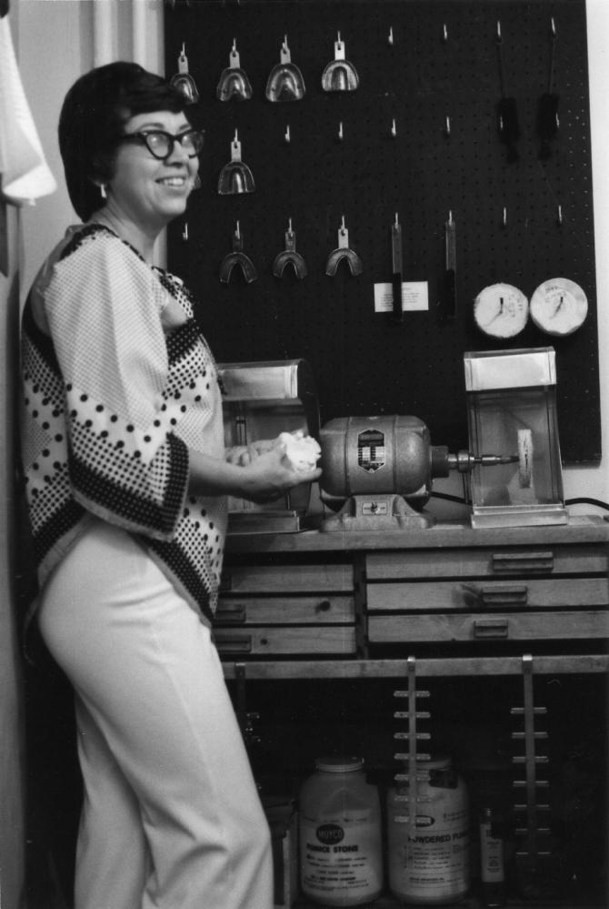 A staff woman in the CHC, Inc. dental lab