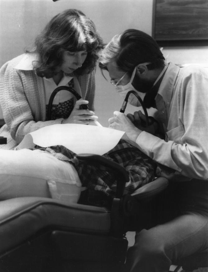 Staff perform a dental exam