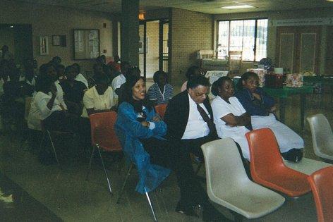 The Audience Listens to the Event Presenter