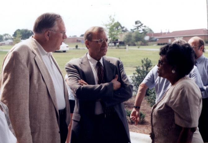 Participants chat after the ribbon cutting