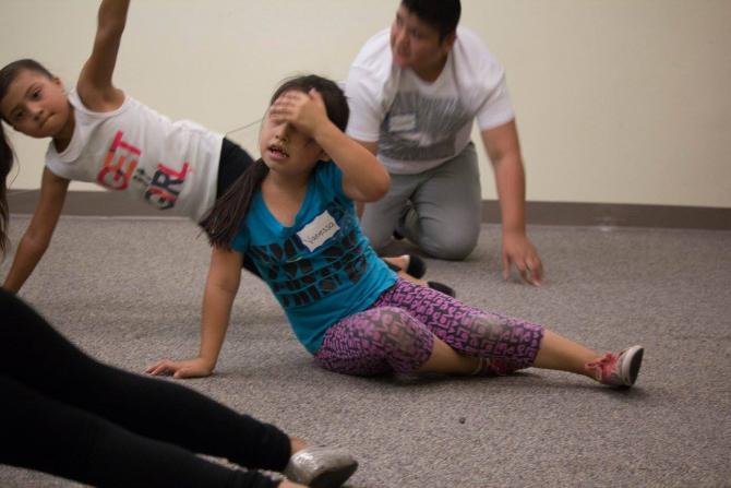 Participants learning a 7 minute workout from Campeones de Salud