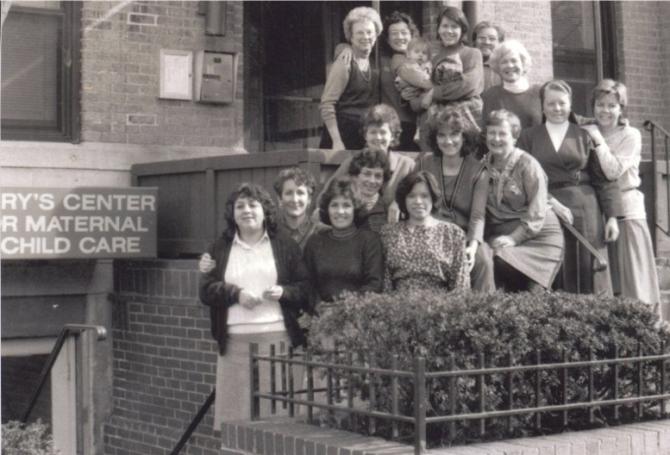 Mary’s Center’s founding staff at its initial building, a basement on Columbia Road, NW, Adams Morgan (1988)