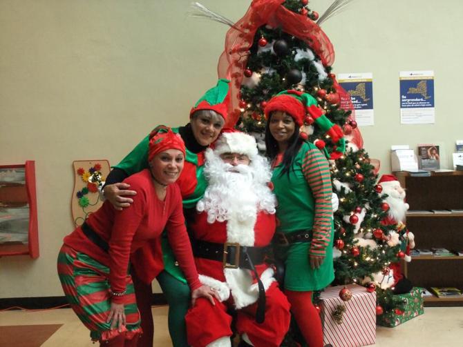 Some elves visiting with Santa 