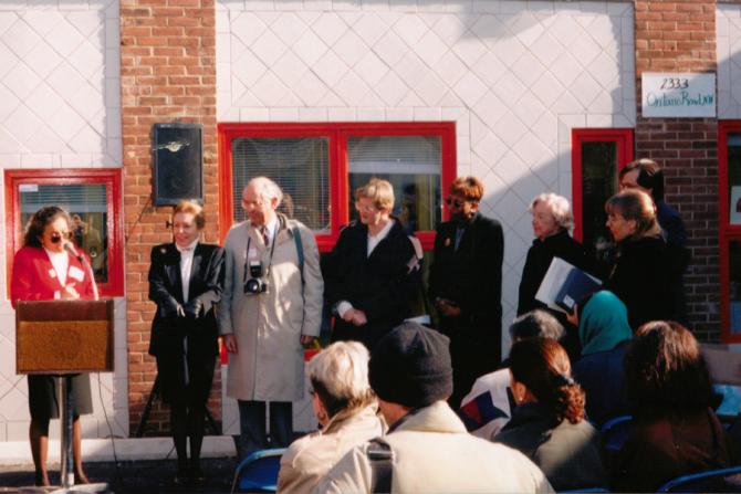 Mary’s Center’s  president and CEO, Maria Gomez, speaks at the grand opening of the center’s grand opening of their current headquarters, located at 2333 Ontario Road, NW, in Adams Morgan, Ward 1 (1994)